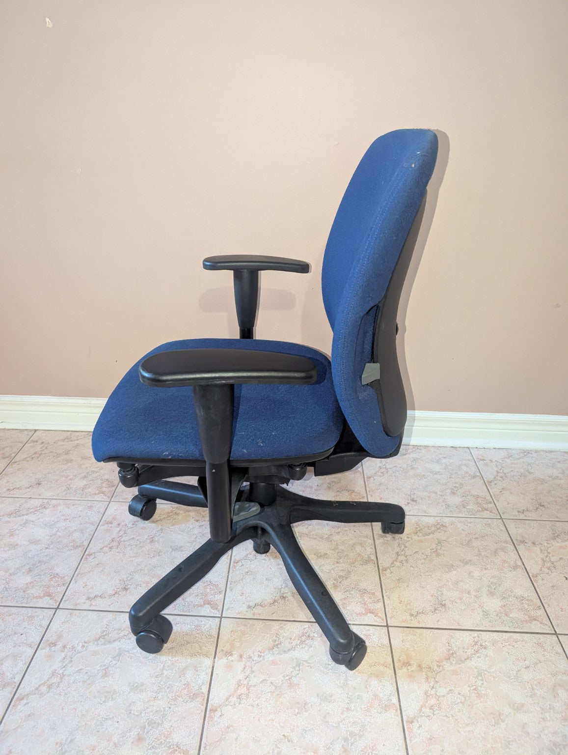 Blue Teknion Amicus fabric office chair, opposite side view
