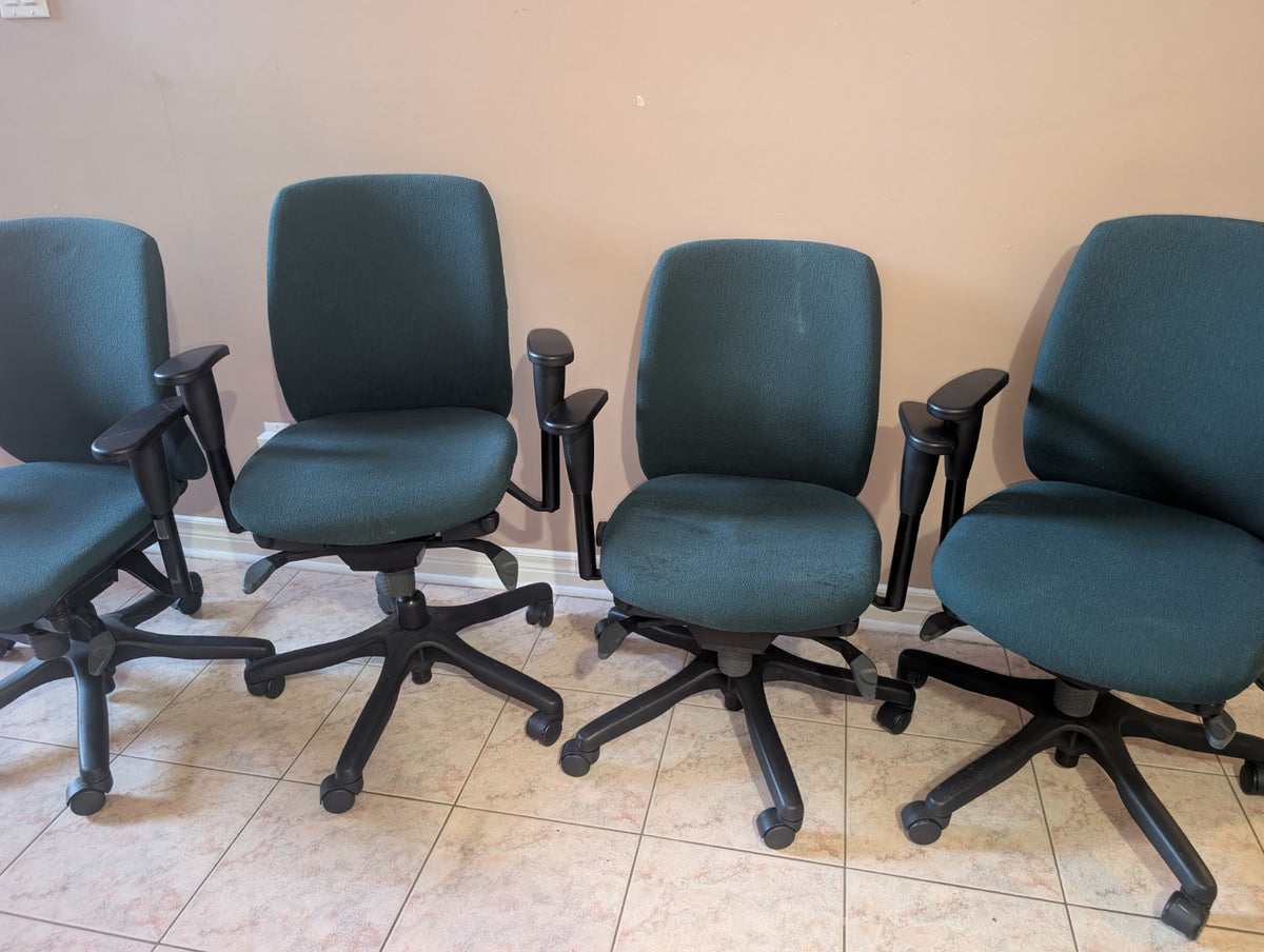 Dark green Teknion Amicus fabric office chair, group view showing condition variations