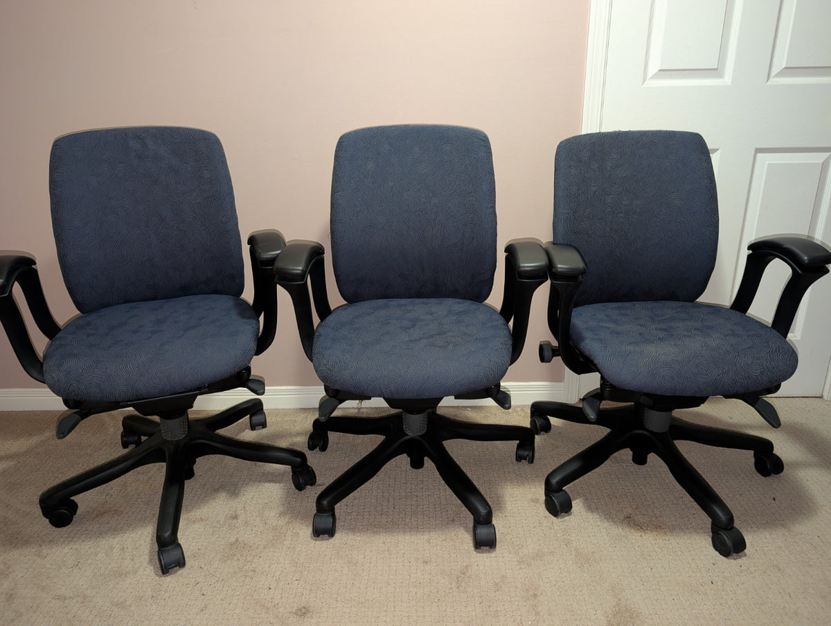 Teknion Amicus office chair with blue-grey patterned fabric, group view