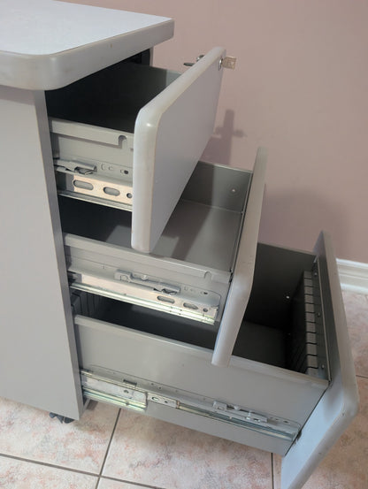 Grey filing cabinet drawer detail