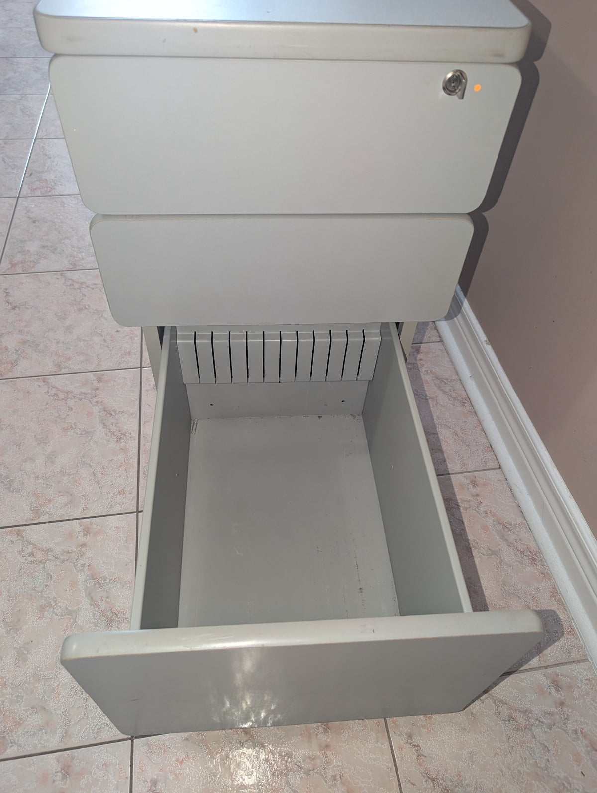 Grey filing cabinet drawer detail