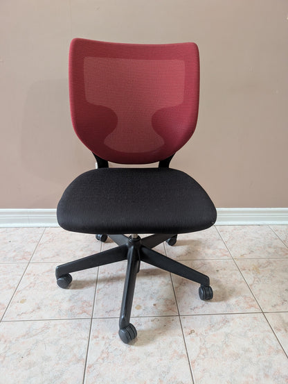 Red and black armless office chair front view