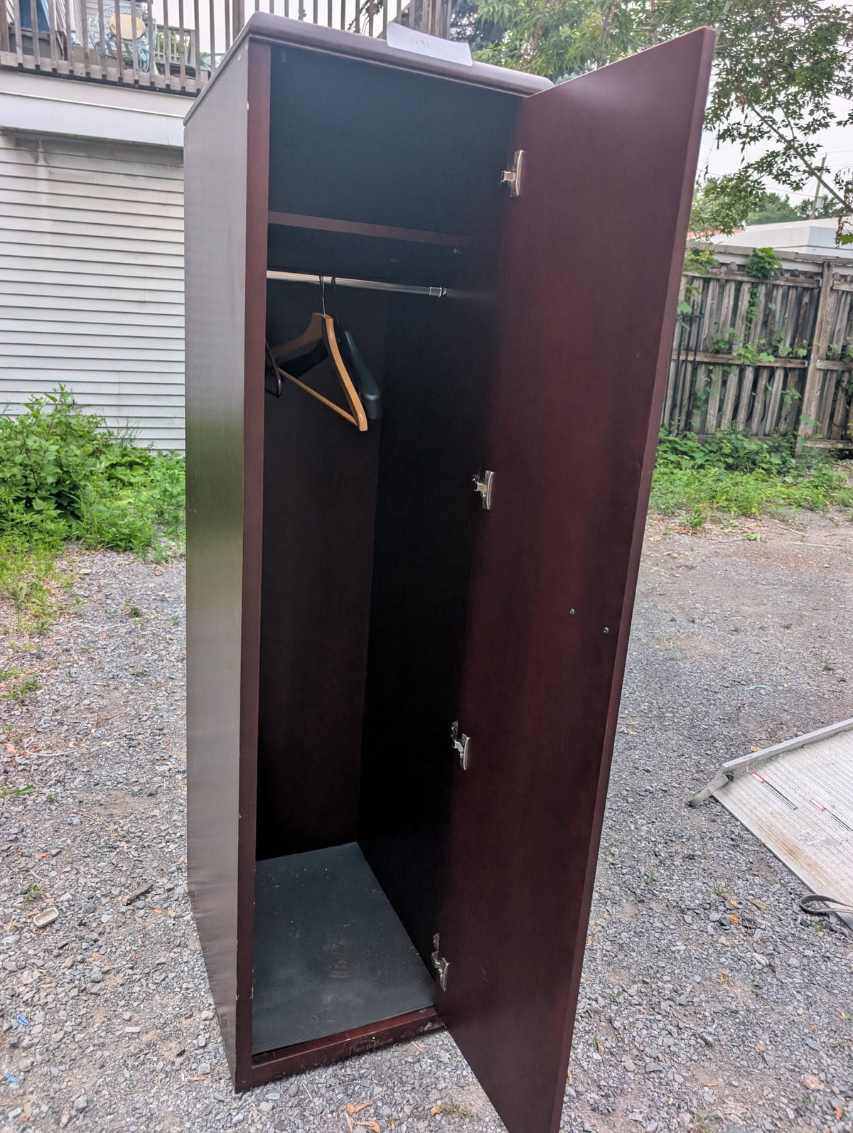 Dark reddish-brown wardrobe cabinet with hanging rail and upper shelf, view 2