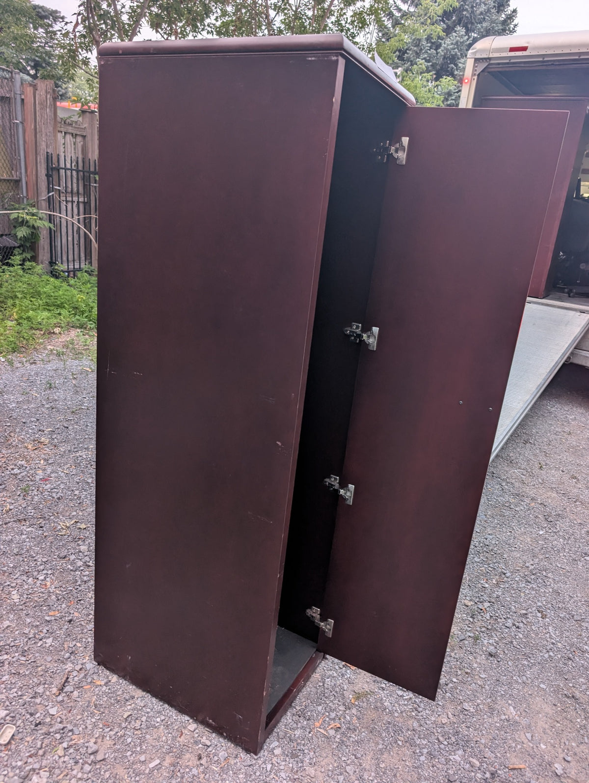 Dark reddish-brown wardrobe cabinet with hanging rail and upper shelf, view 3