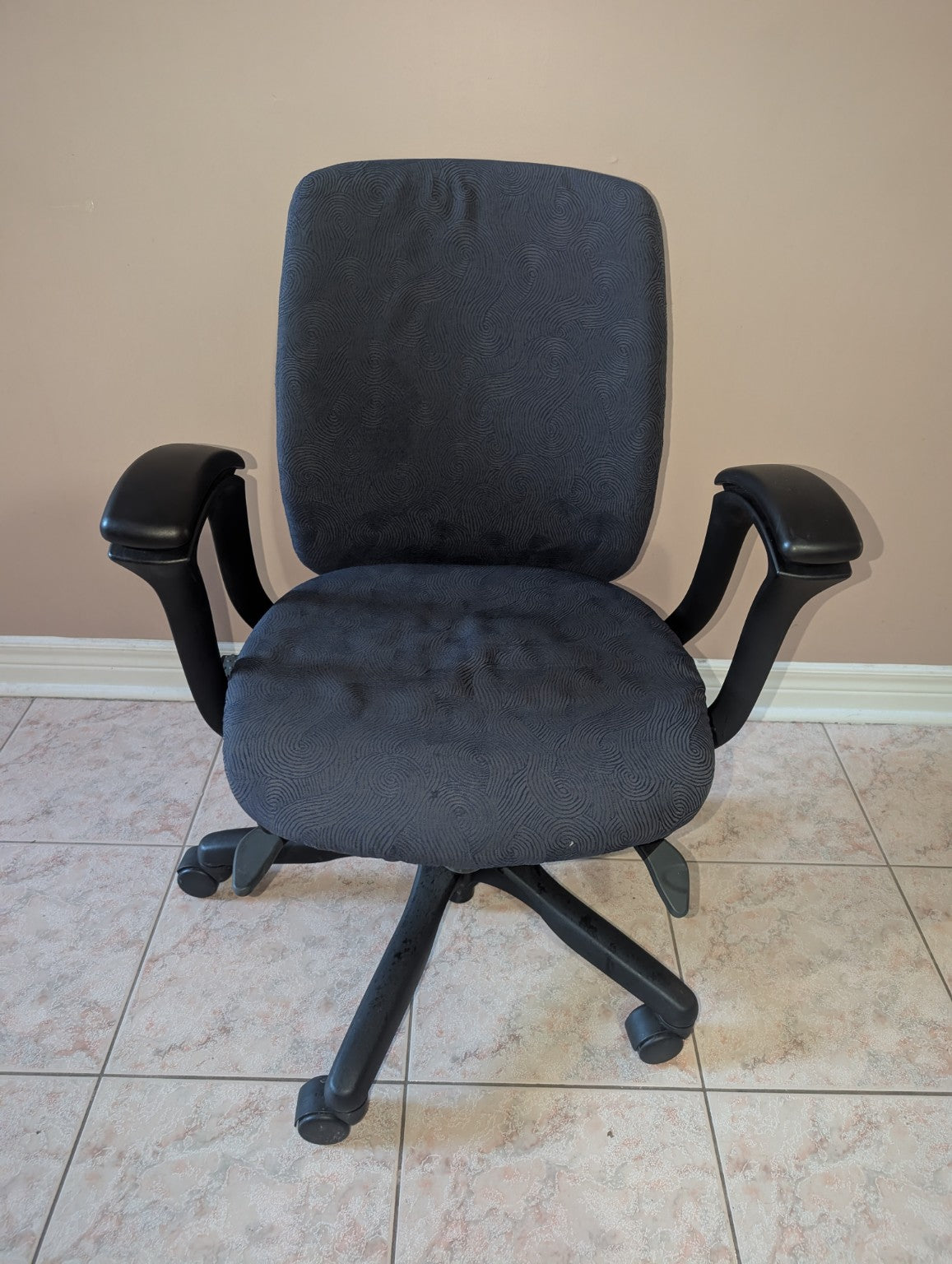 Teknion Amicus office chair with blue-grey patterned fabric, front view