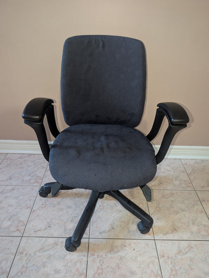 Teknion Amicus office chair with blue-grey patterned fabric, front view