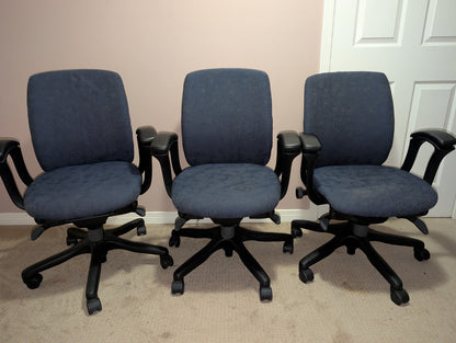 Teknion Amicus office chair with blue-grey patterned fabric, group view