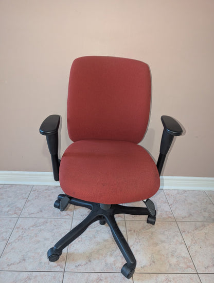 Red Teknion Amicus fabric office chair, front view
