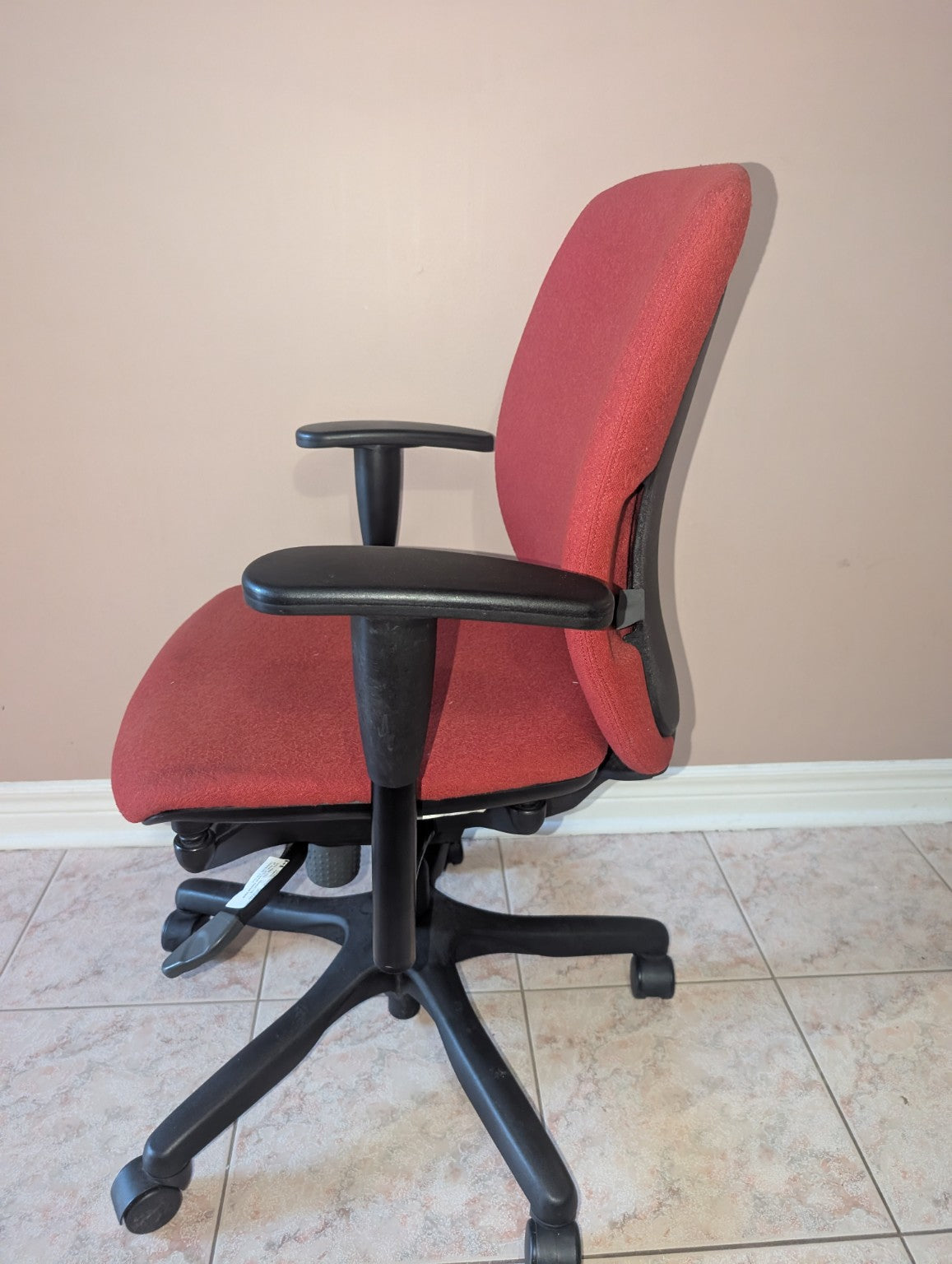 Red Teknion Amicus fabric office chair, side view