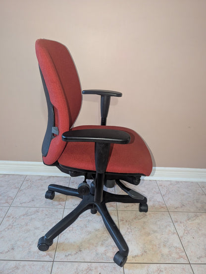 Red Teknion Amicus fabric office chair, opposite side view