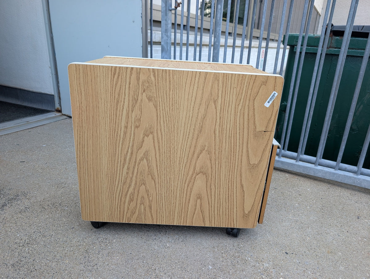 Woodgrain three drawer under table cabinet side view