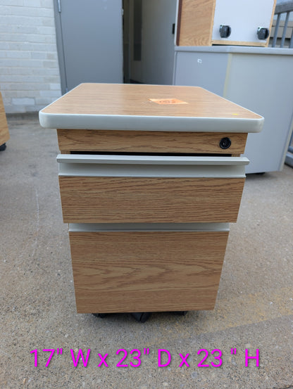 Front view of woodgrain filing cabinet, 17 inches wide by 23 inches deep by 23 inches high